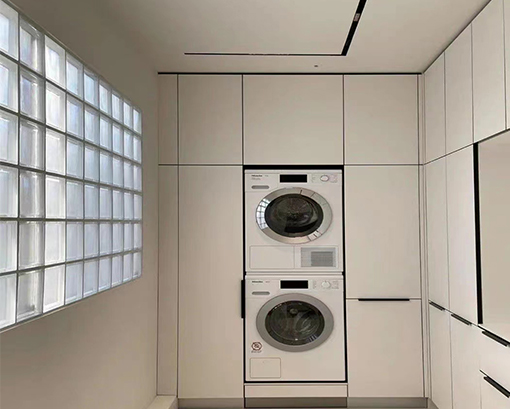 Modern style white laundry room cabinets