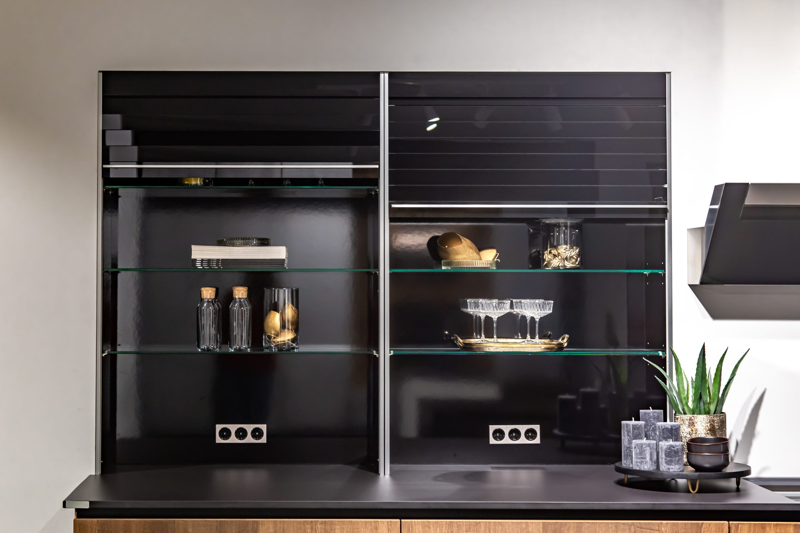 Part of a modern kitchen, a place for cooking, extractor and stove.